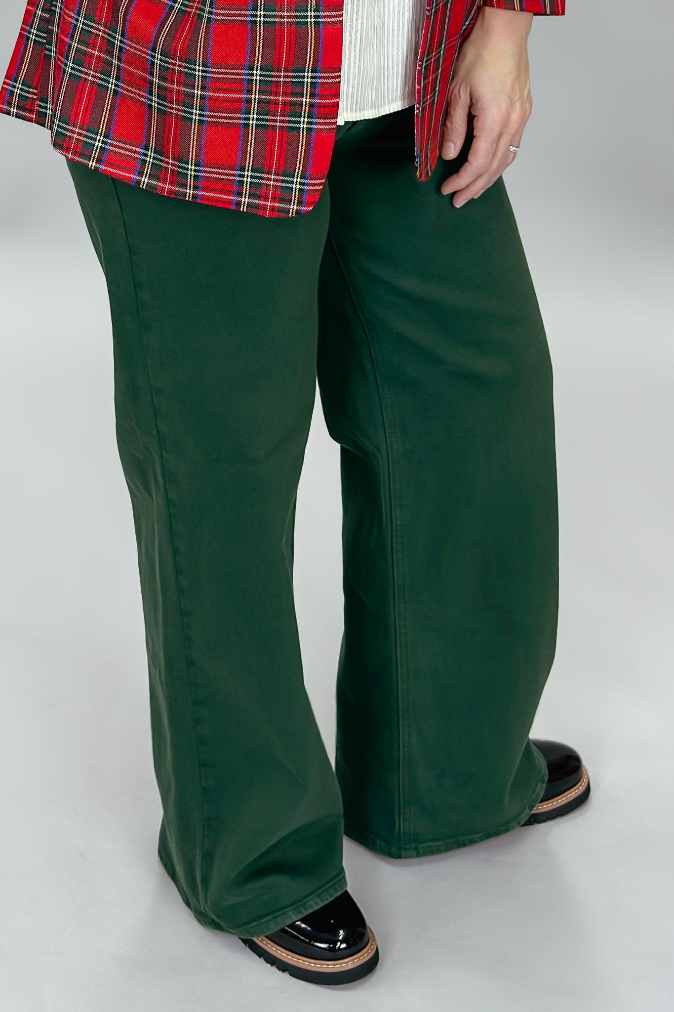 Just USA forest green straight-leg jeans with front and back pockets; angled model view.