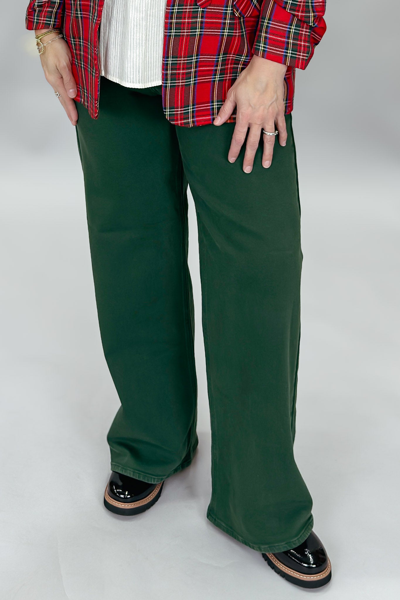 Just USA forest green straight-leg jeans with front and back pockets; front model view.
