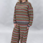 Compania Fantastica multicolor striped sweater and wide-leg pants set; angled model view.