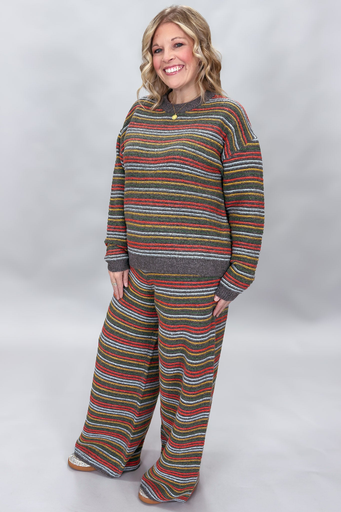 Compania Fantastica multicolor striped sweater and wide-leg pants set; angled model view.