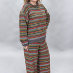 Compania Fantastica multicolor striped sweater and wide-leg pants set; angled model view.