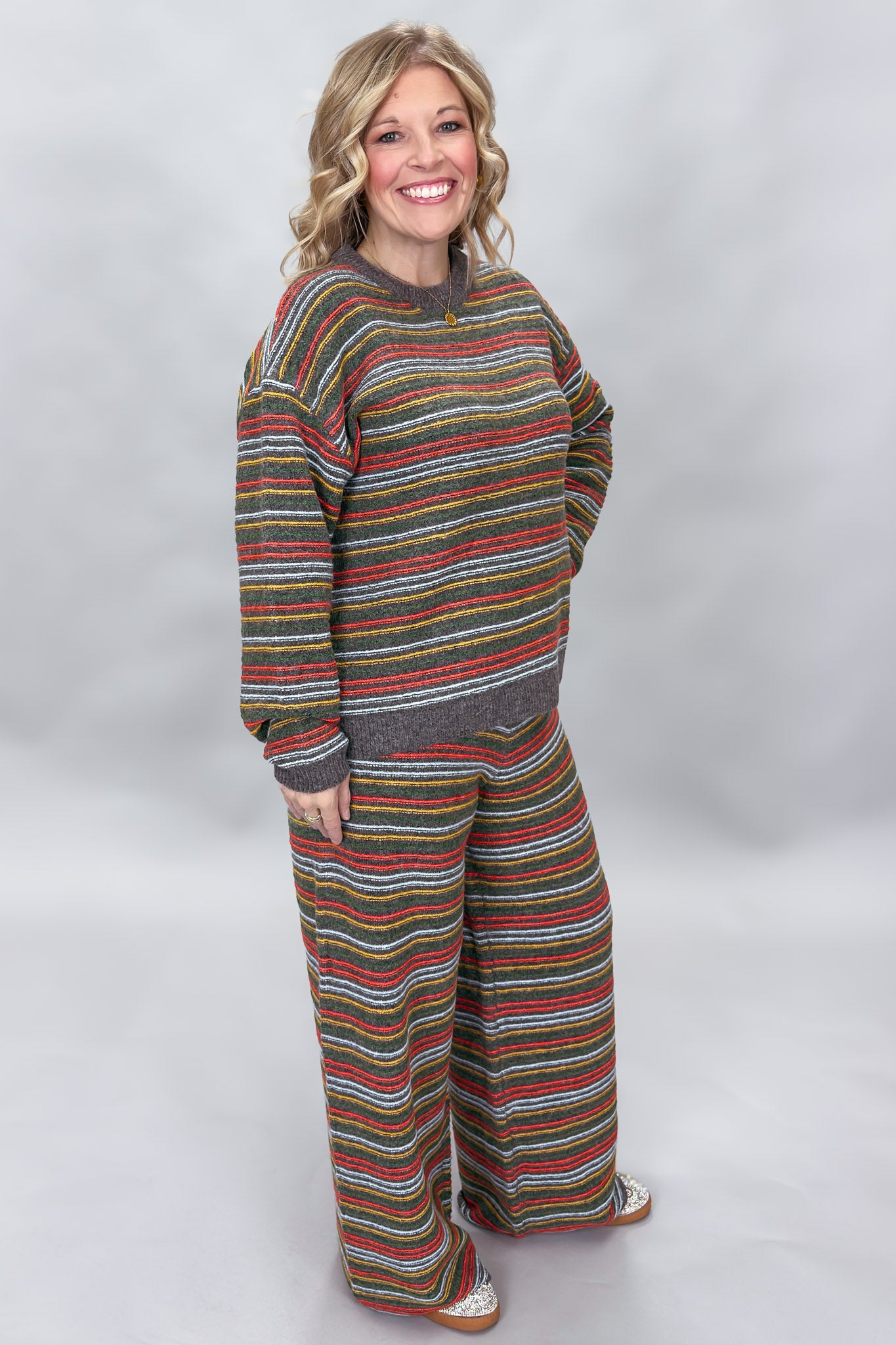 Compania Fantastica multicolor striped sweater and wide-leg pants set; angled model view.