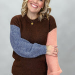 Compania Fantastica mocha sweater with blue and pink sleeves; front model view.