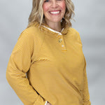 Mustard button-front hoodie showing contrast stripe detail