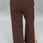 Just Black Denim brown straight-leg jeans with front patch pockets; back view.