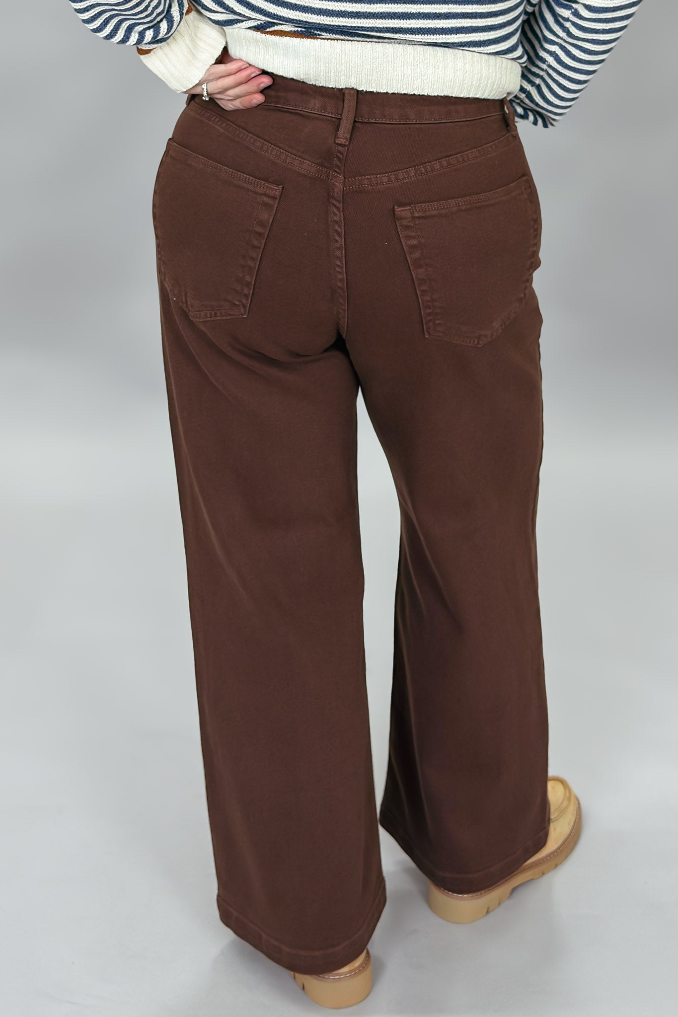 Just Black Denim brown straight-leg jeans with front patch pockets; back view.