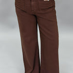 Just Black Denim brown straight-leg jeans with front patch pockets; front pocket and waistband detail.