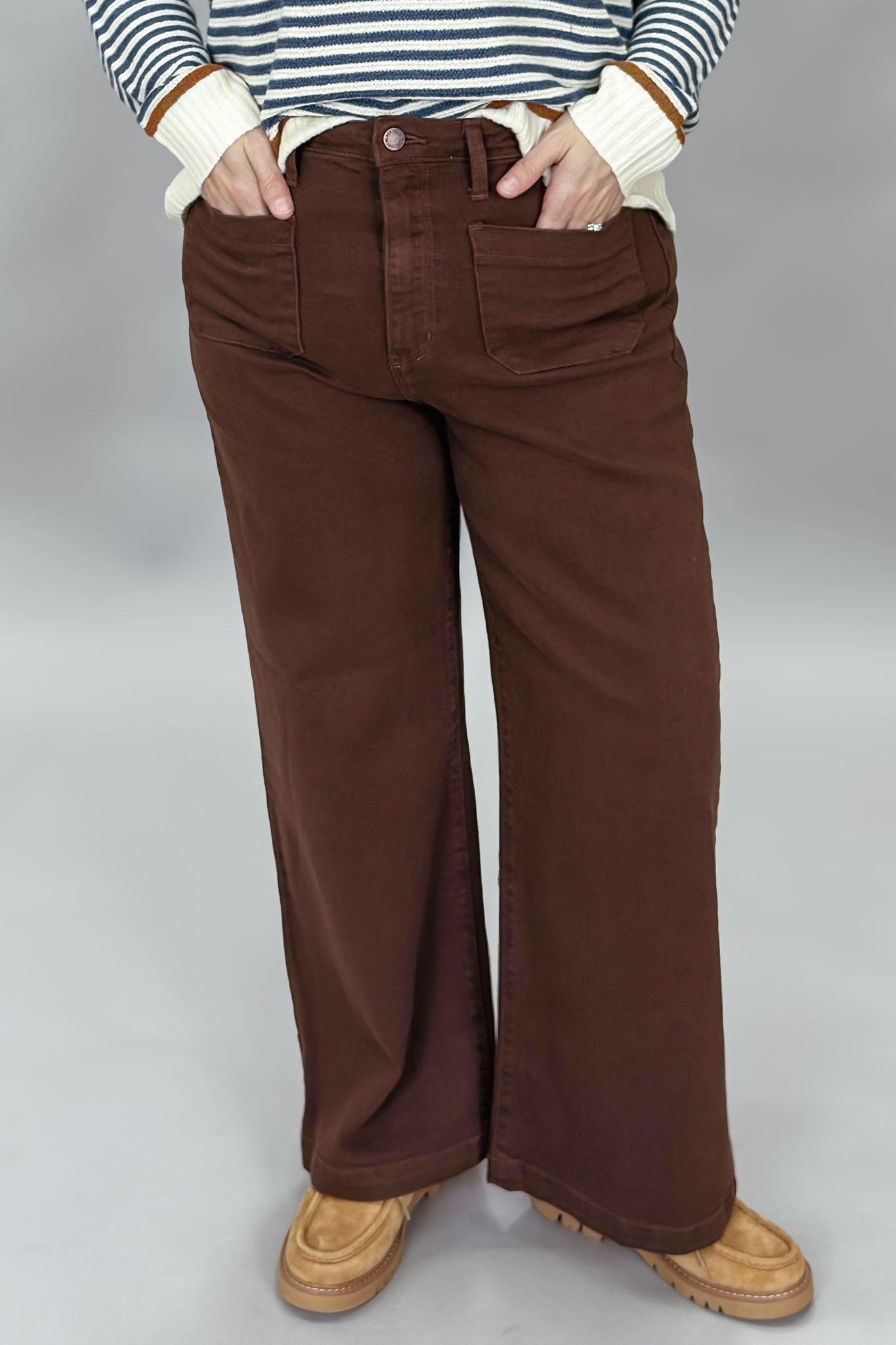 Just Black Denim brown straight-leg jeans with front patch pockets; front pocket and waistband detail.
