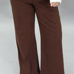 Just Black Denim brown straight-leg jeans with front patch pockets; front model view.