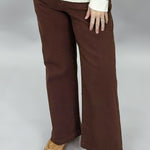 Just Black Denim brown straight-leg jeans with front patch pockets; front model view.