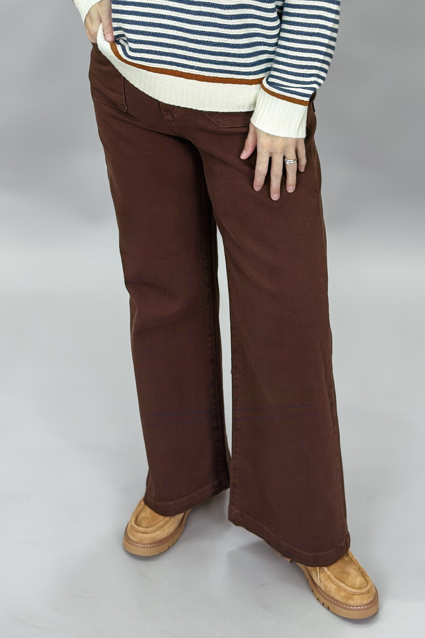 Just Black Denim brown straight-leg jeans with front patch pockets; front model view.