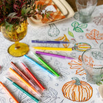 Autumn coloring runner partially colored in with markers and table decorations as display props