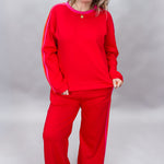FATE red crewneck top and wide-leg pants set with pink stripes; front model view.