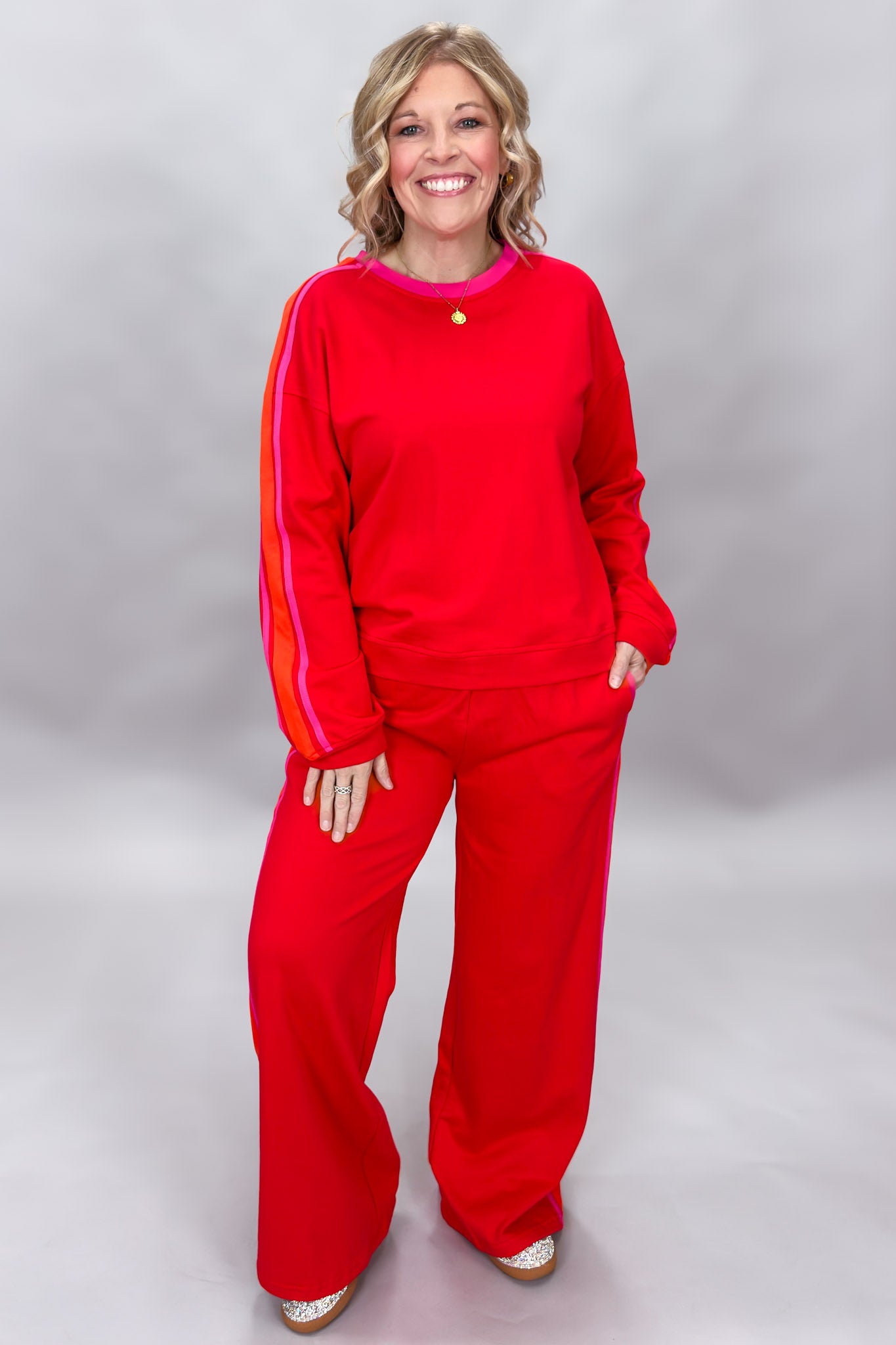 FATE red crewneck top and wide-leg pants set with pink stripes; front model view.