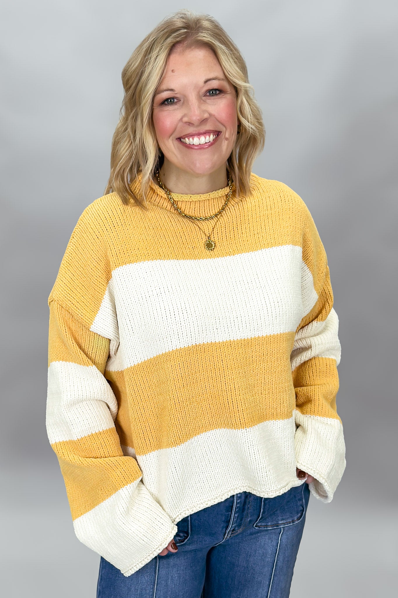 Mustard and ivory colorblock knitted sweater, styled view