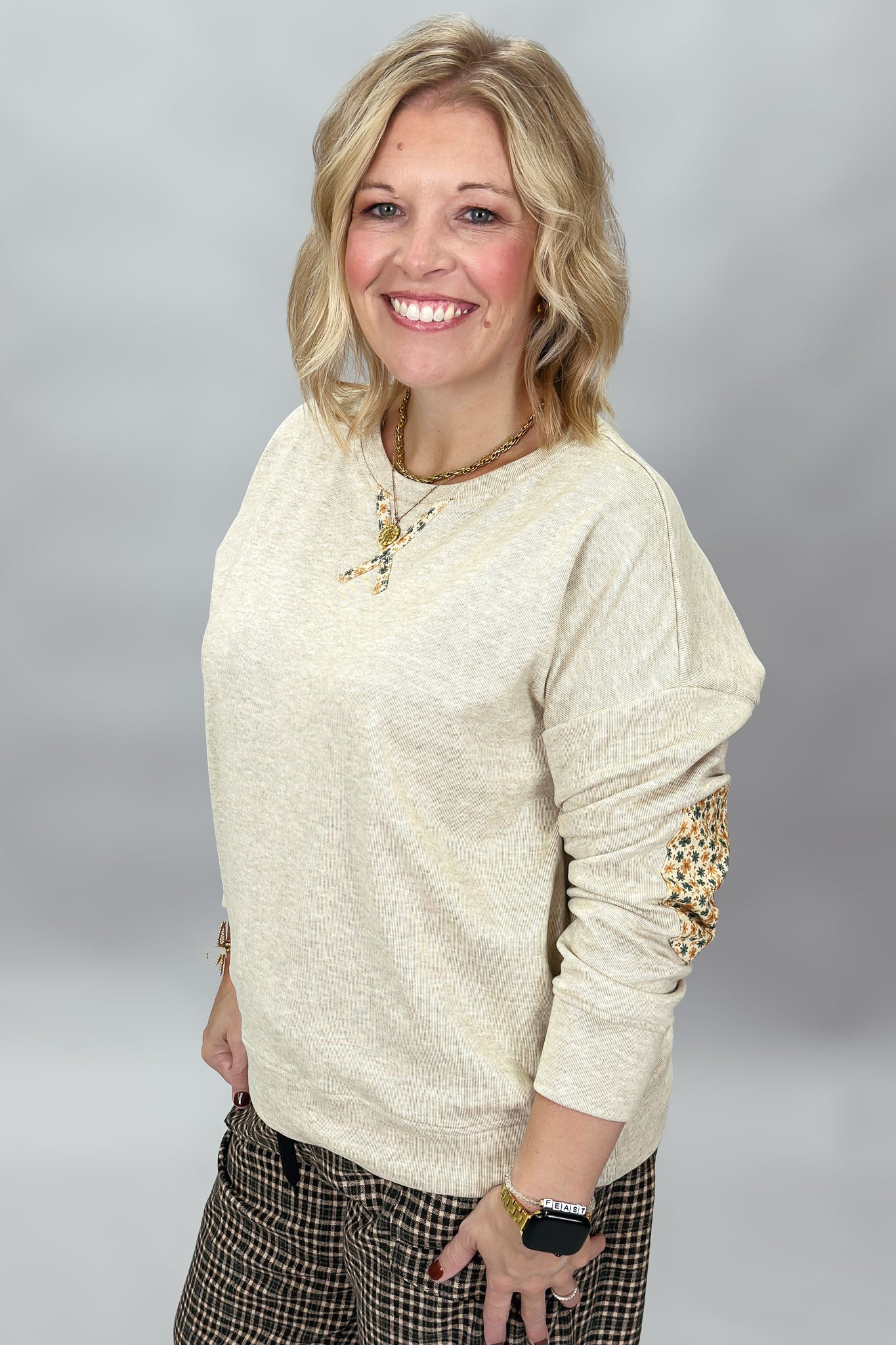Staccato oatmeal sweatshirt showing floral elbow patch detail