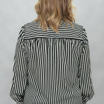 FATE black and cream striped tie-neck blouse with gathered cuffs; back view.