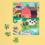 WerkShoppe Farm Friends assembled farm puzzle with loose pieces on a yellow background