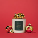 Hico Candle Co. Vintage Christmas candle with Christmas decorations against a red background; display suggestion, props not included