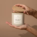 Hico Candle Co. Wild Sage & Pumpkin candle held with the lid lifted